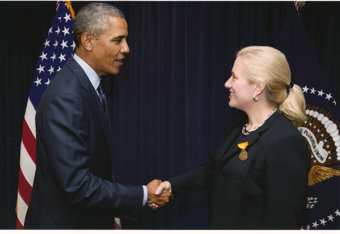 President Obama presents Summer Jones with The Secretary of Defense Meritorious Civilian Service Award 