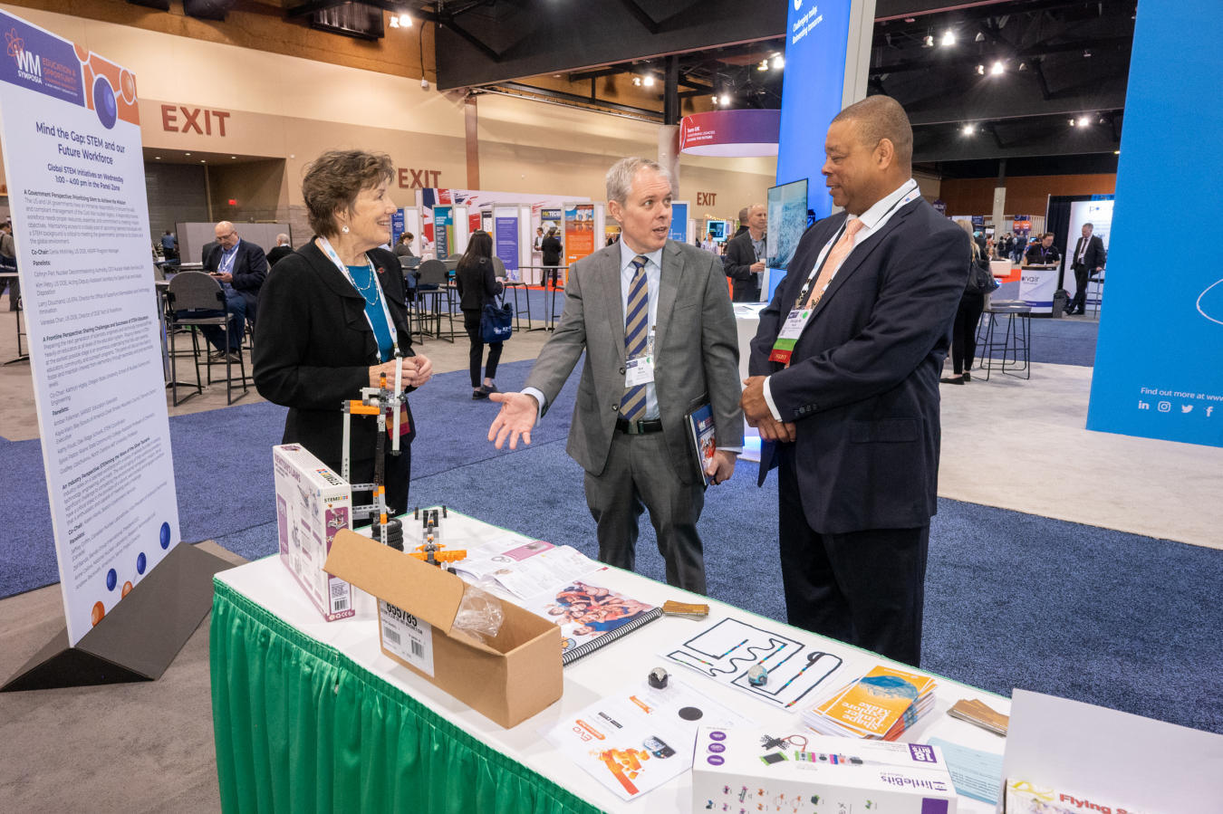 EM Senior Advisor Ike White discusses the Lab in a Box STEM Kit with Susan Stiger, president of the Waste Management Symposia (WMS), and George Taylor, WMS STEM Committee Member, during the 2022 symposia held March 6-10 in Phoenix.