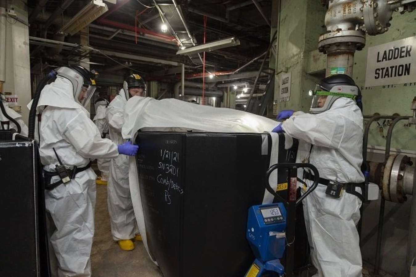 UCOR workers remove waste from Alpha-2 as part of deactivation work at the Y-12 National Security Complex at Oak Ridge.