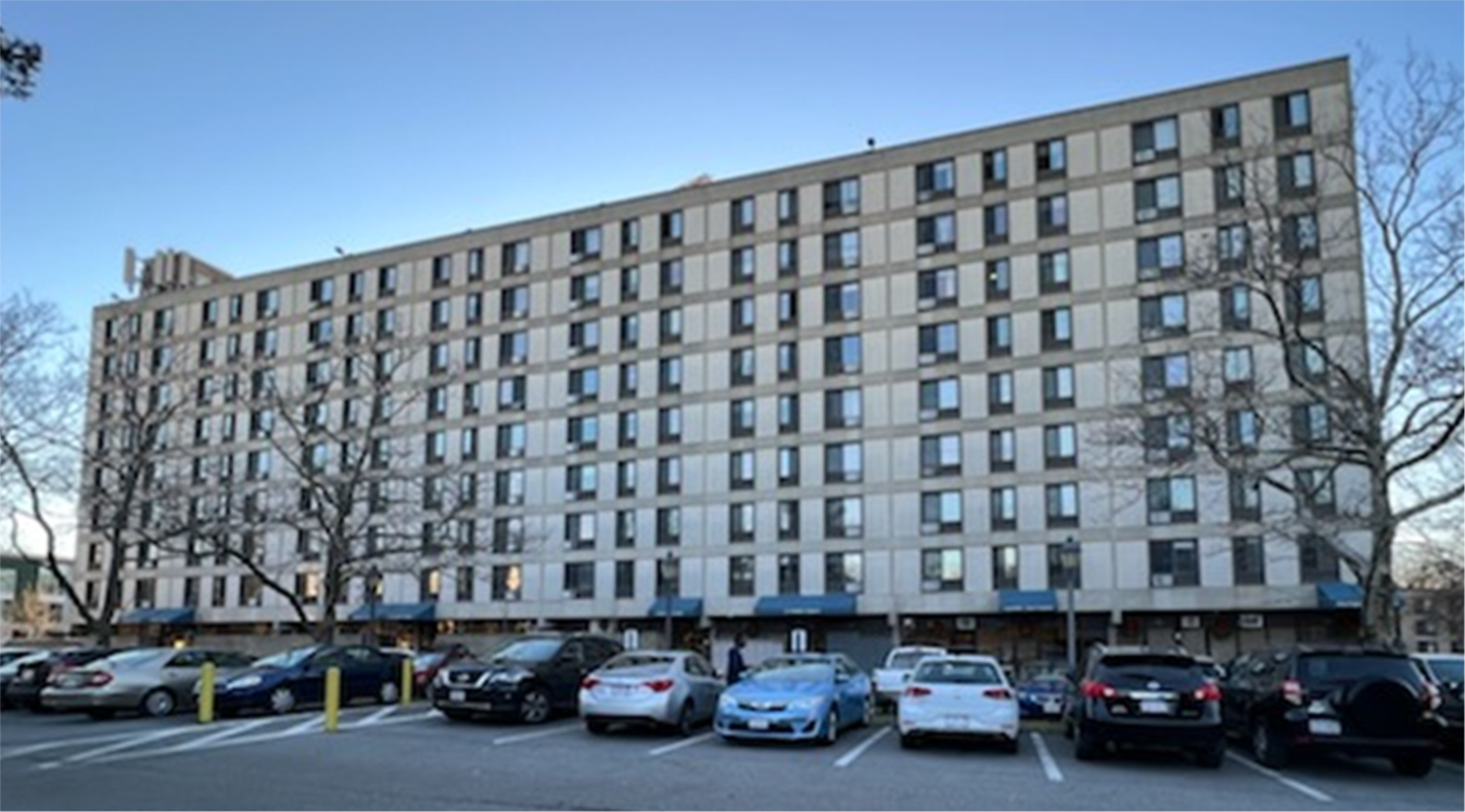 Exterior of a nine-story multifamily housing building.