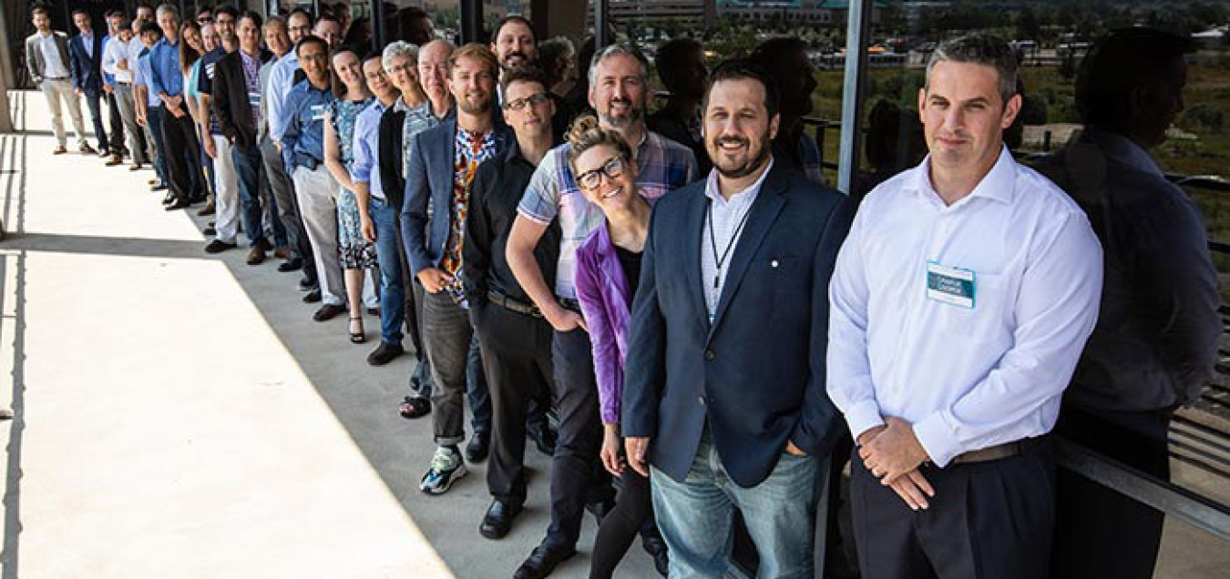 A group of people standing outside.