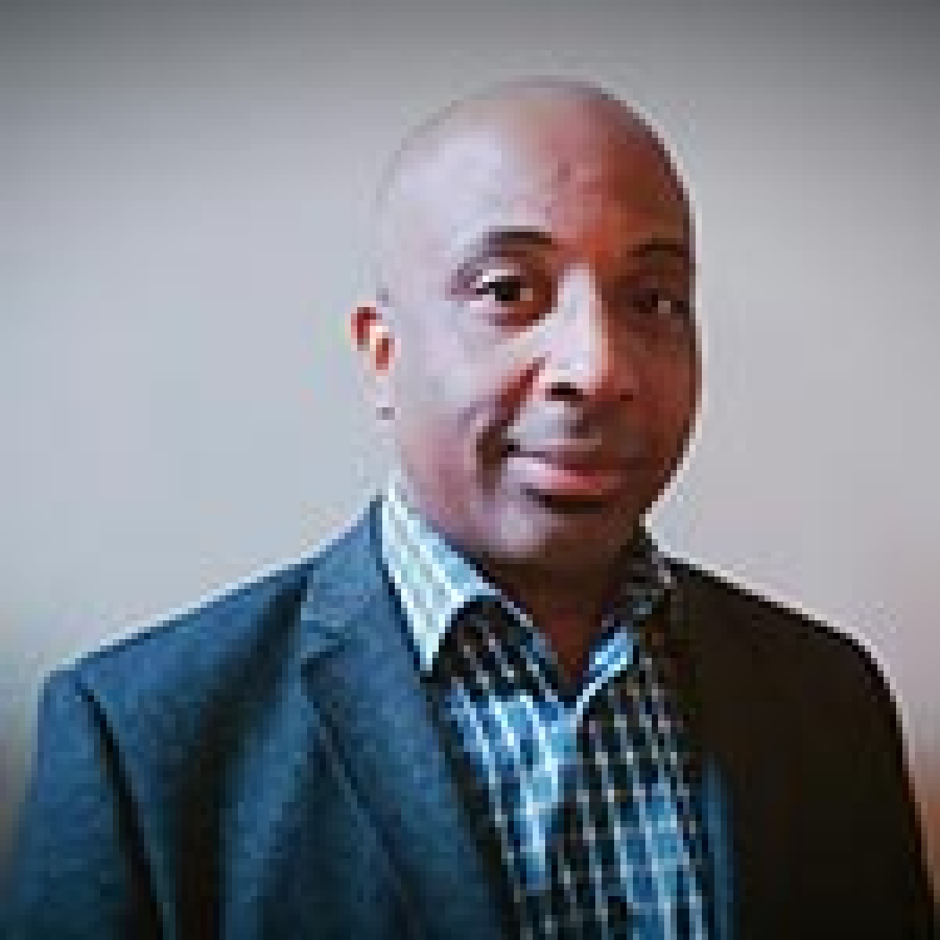 Image of a professional man wearing a sport coat and collared shirt