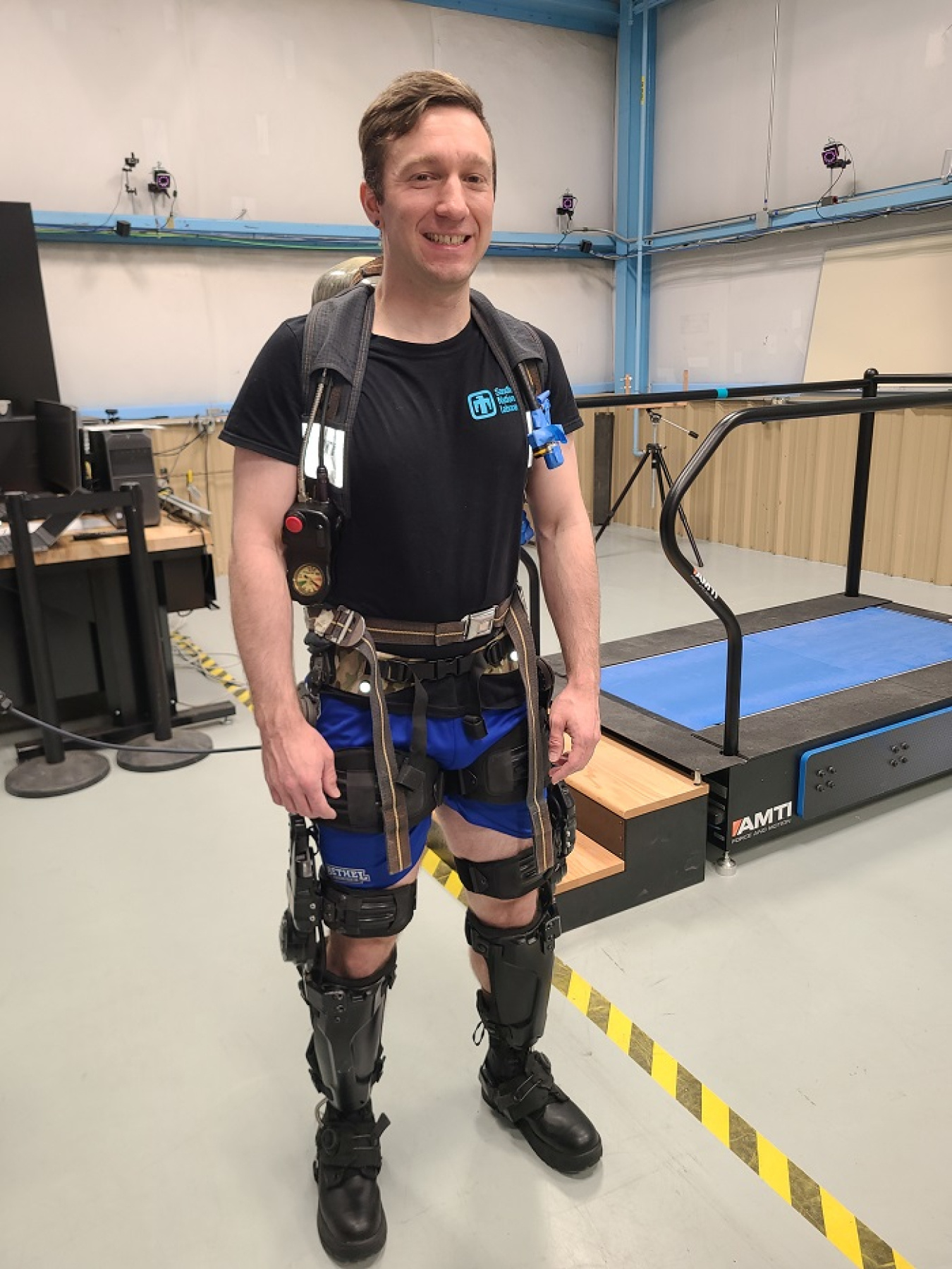 Nick Wright, a mechanical engineer with Sandia National Laboratories, participates in a study of wearable robotics for tank farm workers who carry self-contained breathing apparatus (SCBA) respirators. In addition to the SCBA oxygen tank, Wright is wearing a powered knee exoskeleton device. The study will help determine if exoskeleton devices reduce fatigue and injury in EM workers.