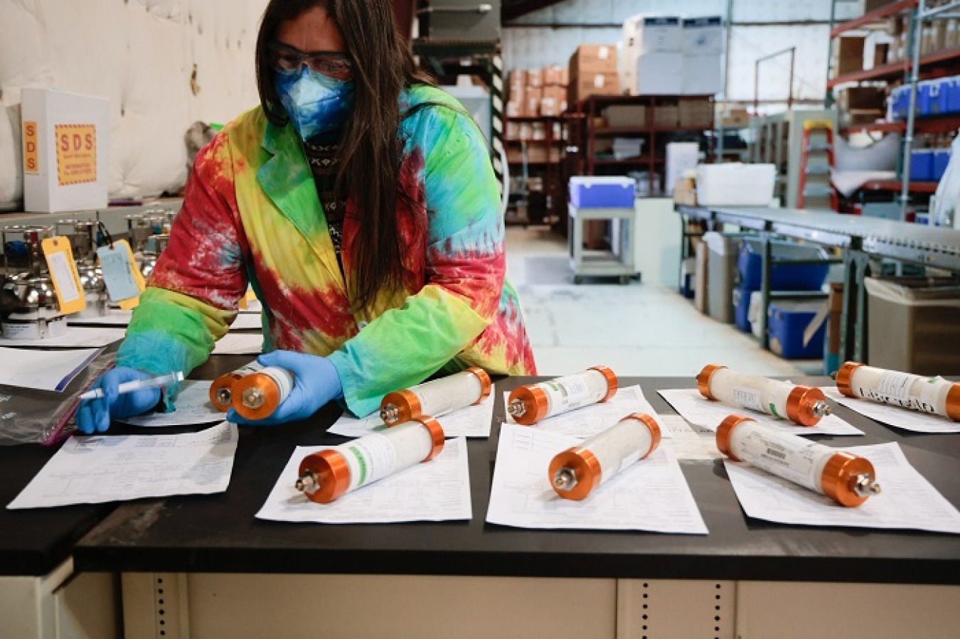 Lisa Tower, a manager at the Newport News Nuclear BWXT-Los Alamos (N3B) Sample Management Office, inspects samples from a vapor plume that exists in soil beneath one of Los Alamos National Laboratory’s historical landfills, where hazardous materials were disposed and buried underground. N3B helped develop software functionalities that allow for faster and more comprehensive validation of results from such samples to assess the nature and extent of contamination in the environment.