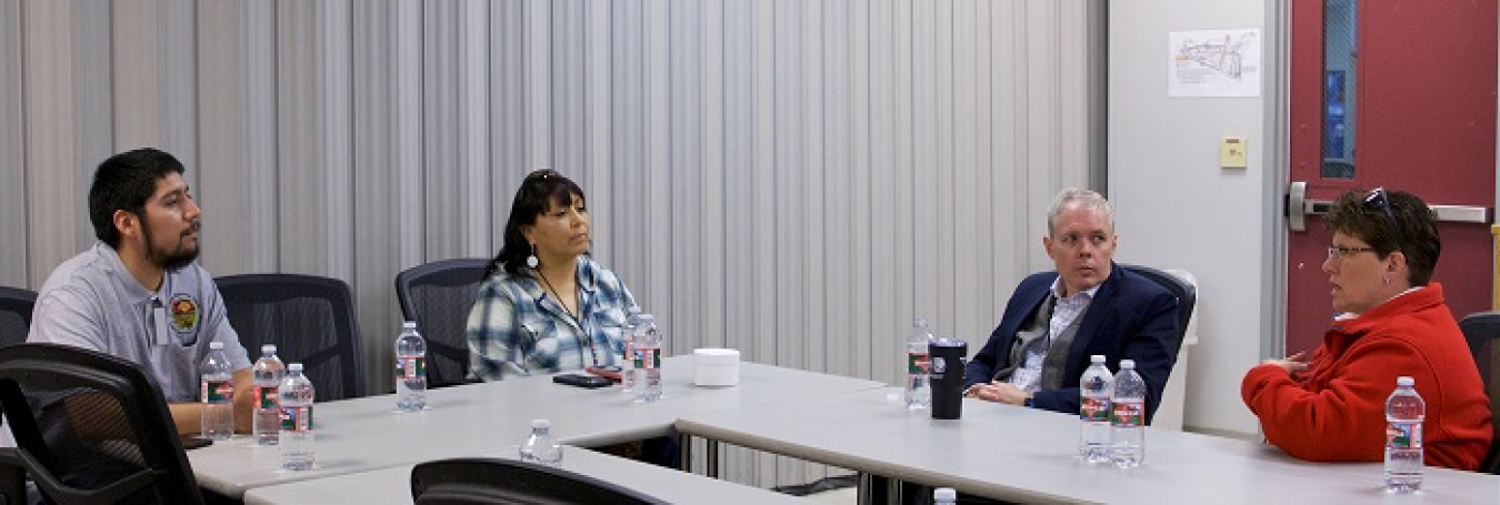 EM Senior Advisor William “Ike” White, second from right, and Idaho Cleanup Project Manager Connie Flohr, far right, speak with representatives of the Shoshone-Bannock Tribes, including Tribal DOE Program Senior Scientist Keith Moore, far left, and Tribal DOE Cultural Resources Specialist LaRae Bill.