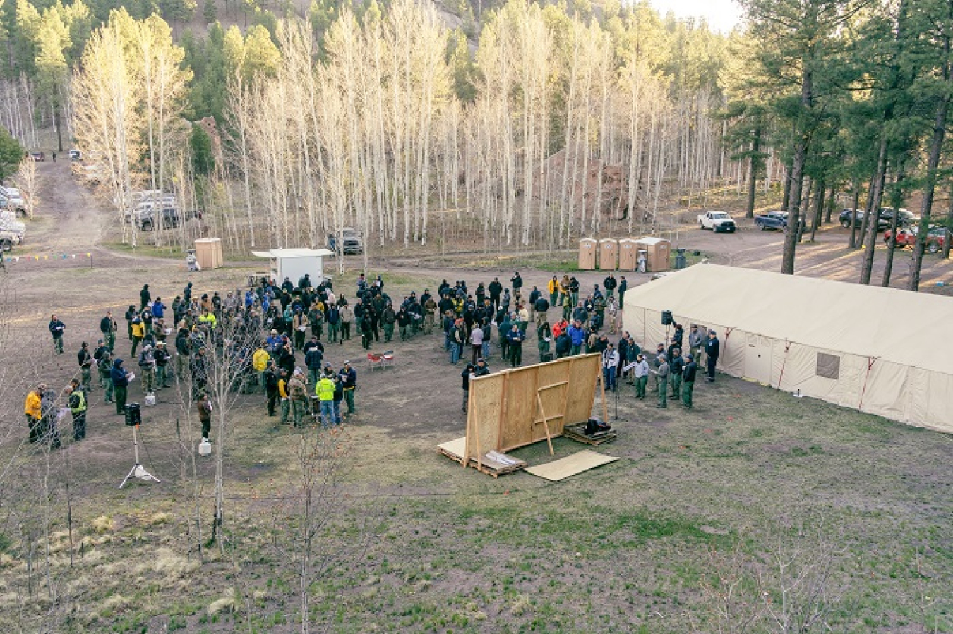 Members of Great Basin Team 1 gather for a morning briefing at base camp in Jemez Springs, New Mexico. Crews have been mobilized since April 22 to focus their firefighting expertise on the Cerro Pelado fire. 