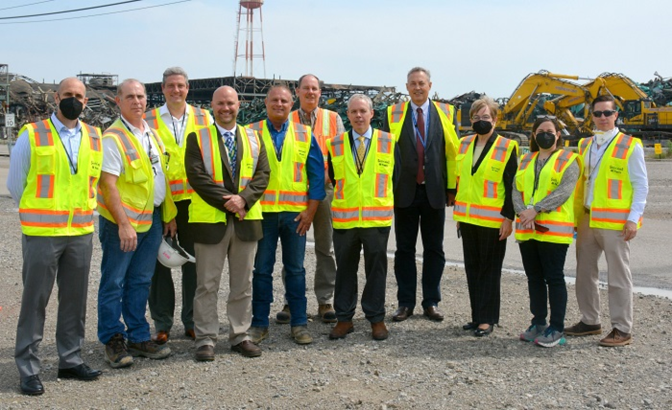 Officials gather outside the Building X-326 demolition project while on a tour of the Portsmouth Site.
