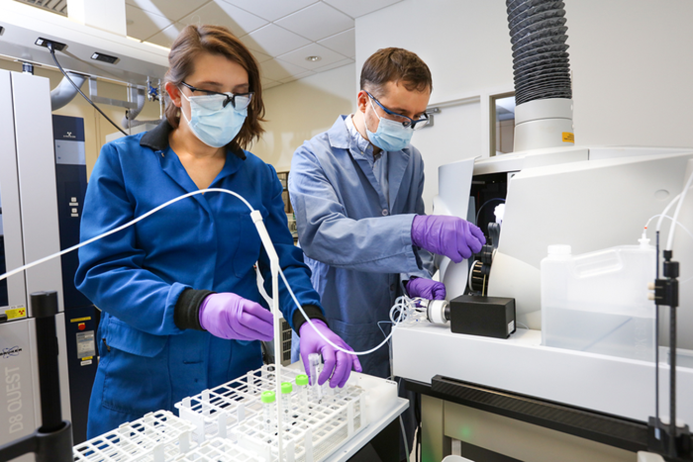 Santa Jansone-Popova, left, and Ilja Popovs quantify rare-earth element concentrations in liquid samples using a spectroscopy instrument. Credit: Genevieve Martin/ORNL, U.S. Dept. of Energy