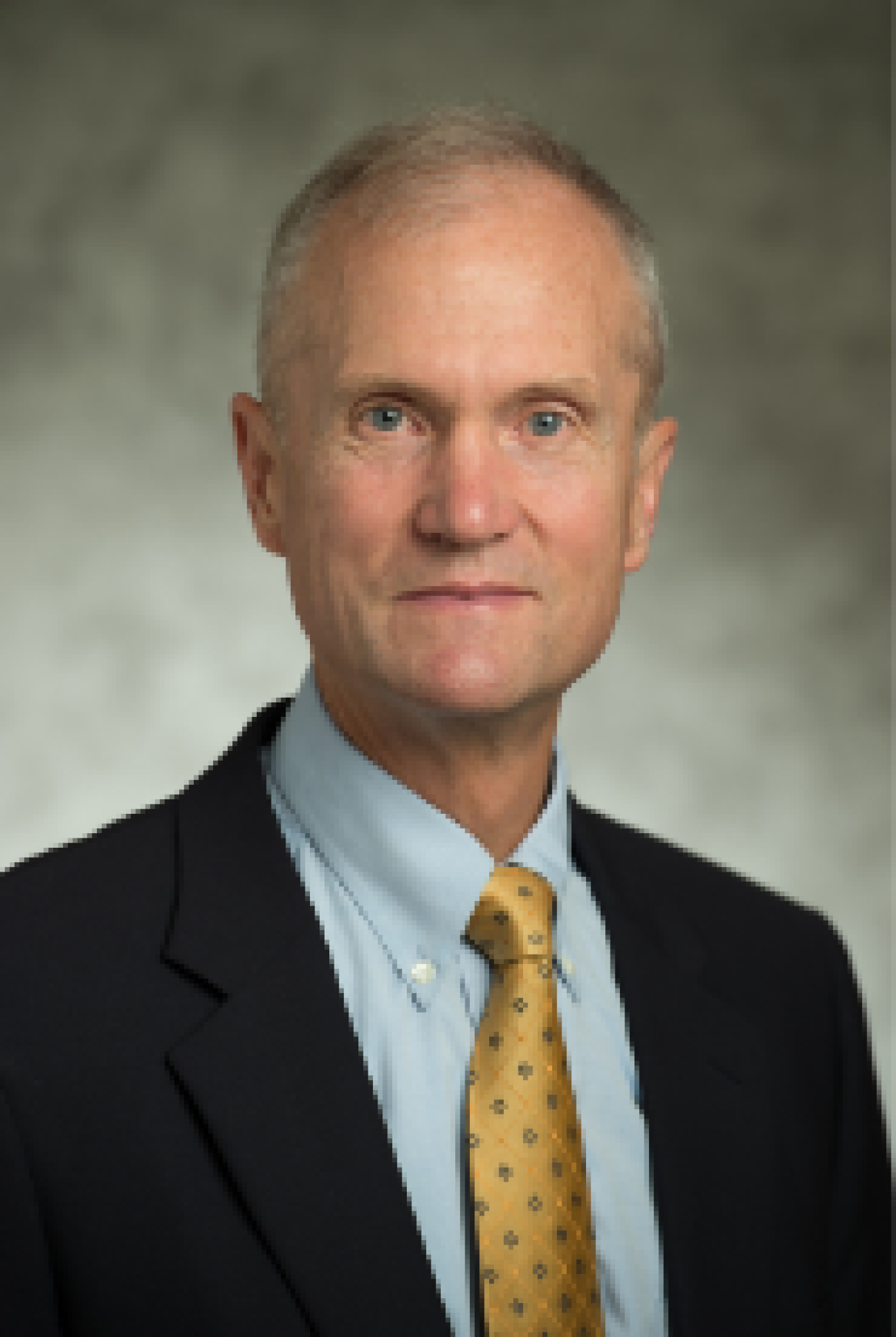 Headshot of Jim Ahlgrimm in a suit.