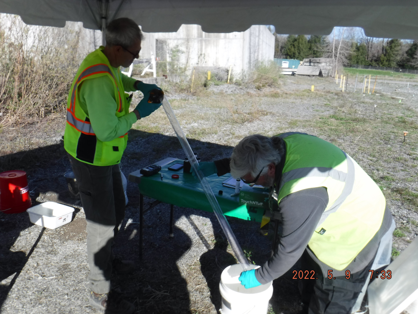 Chuck Roesch, left, and Marty Regan, employees with EM West Valley Demonstration Project cleanup contractor CH2M HILL BWXT West Valley, conduct focused sampling as part of a closure plan for a former waste storage area site