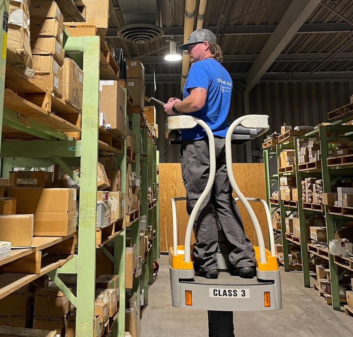 Hanford Mission Integration Solutions Storekeeper Cooper Whitney counts items in a Hanford Site warehouse as part of the 100% wall-to-wall inventory process.
