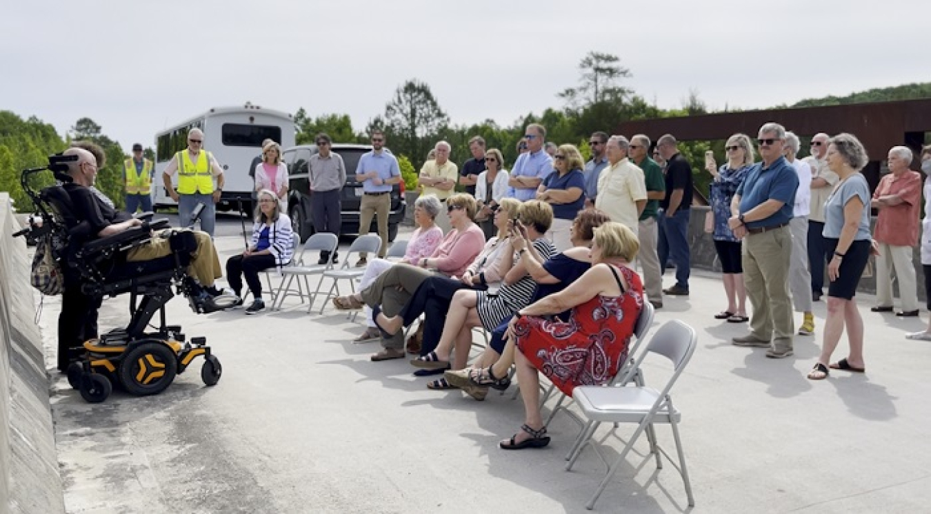 The Haul Road in Oak Ridge was closed for about an hour during a ceremony earlier this month dedicating the Haul Road bridge in Oak RIdge in Steve McCracken’s honor. Friends, family and former co-workers of McCracken, pictured at left, attended the event. 