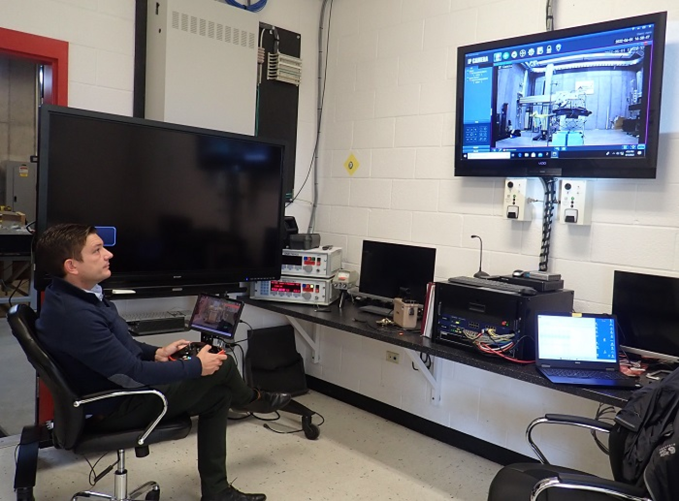 Gaël Brésolin, with drone manufacturer Flyability, Inc., flies a drone remotely inside the Idaho Accelerator Center Imaging Laboratory at Idaho State University. EM has partnered with physicists at the laboratory to test the drone’s ability to operate under high levels of radiation.