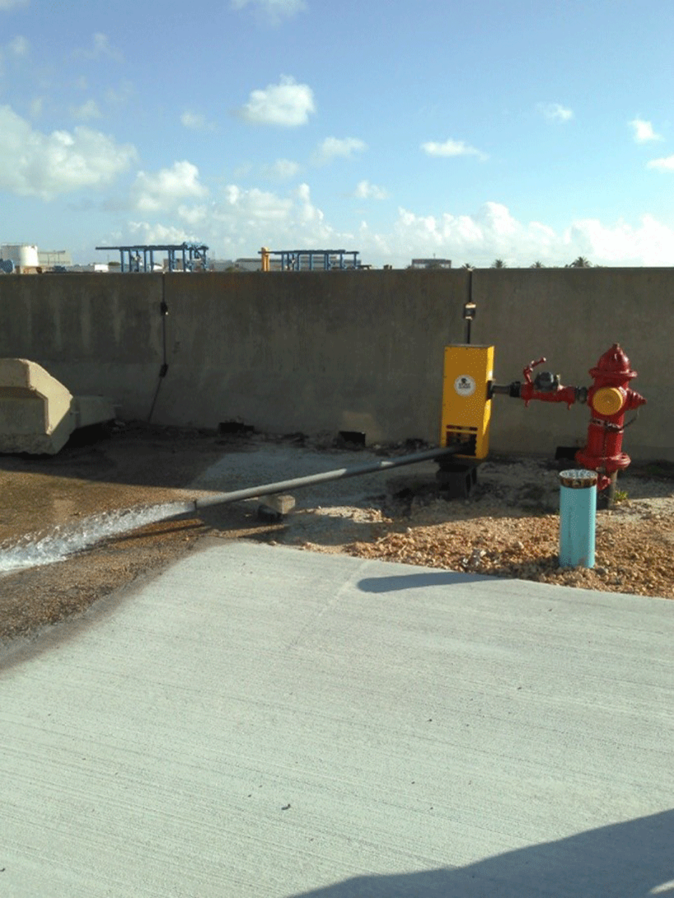 A fire hydrant being flushed.