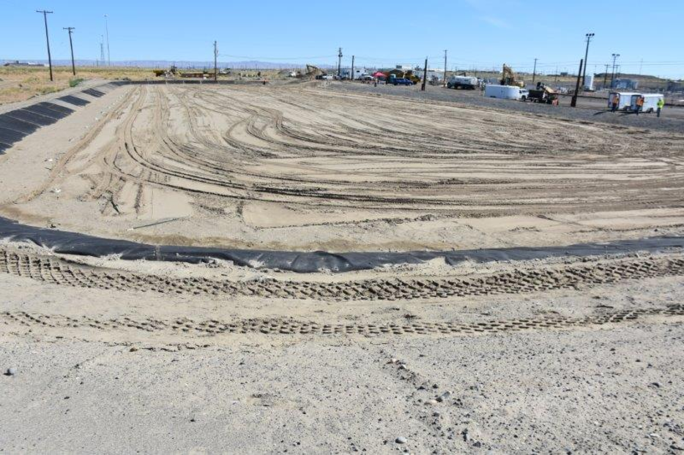 Clean dirt was used to backfill the evapotranspiration basin after piping and plastic liners were installed. Later this year, native plants and grass will be planted in the basin.