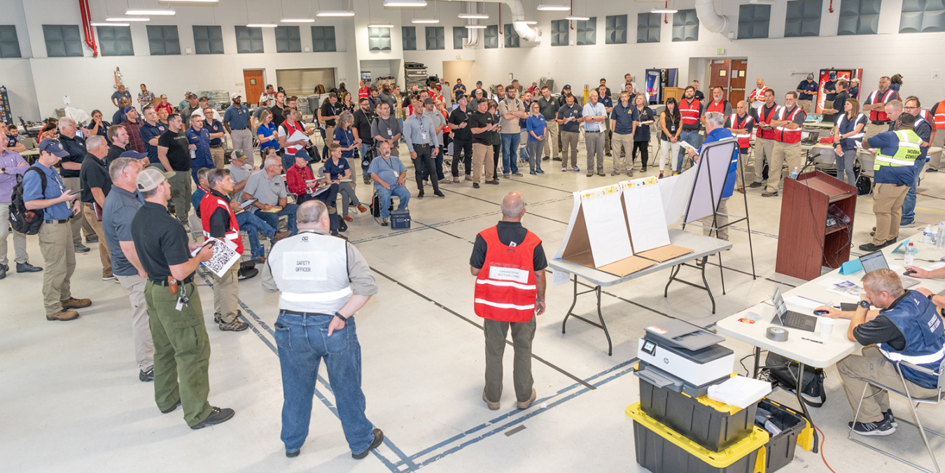 The leaders of the exercise do a pre-brief for hundreds of participants at the Armed Forces Center in Austin, which hosted the Cobalt Magnet 22 command post.