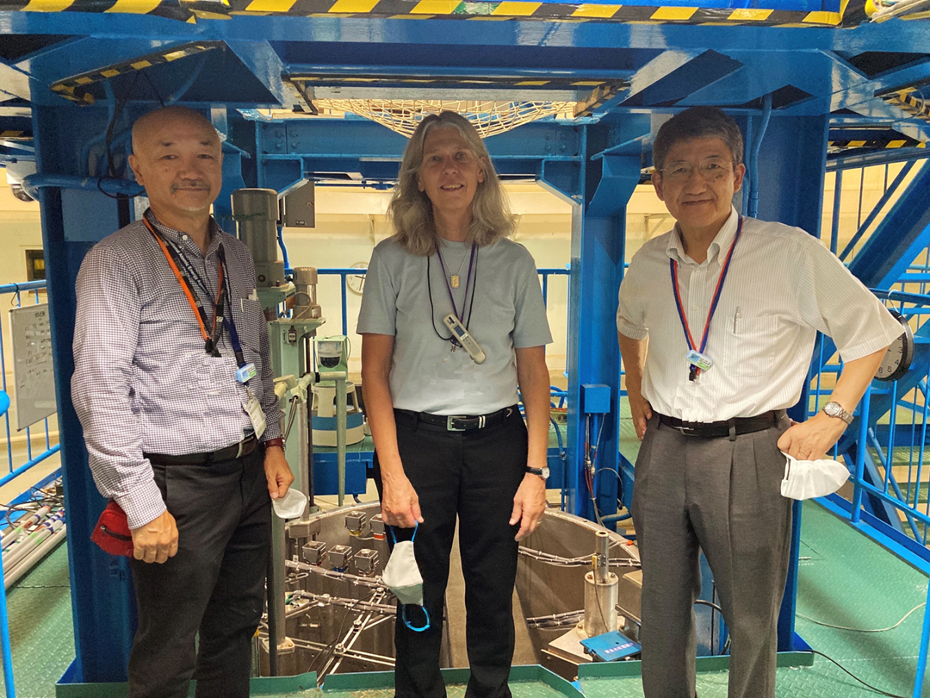 NNSA Administrator Hruby in the KUCA reactor room with Professor Hironobu Unesaki, left, and Ken Nakajima, Director of the Institute for Integrated Radiation and Nuclear Science at Kyoto University.