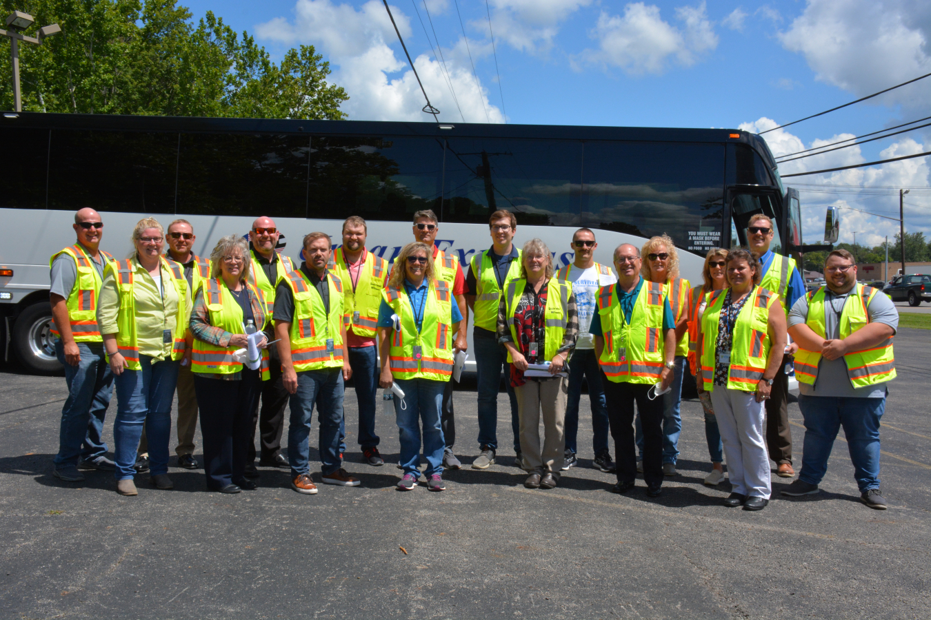 Board members from the Pike County Chamber of Commerce gather outside the tour bus along with site escorts Jack Williams and Charles Love, pictured far right, prior to their recent visit to the Portsmouth Site, where they viewed environmental cleanup projects.
