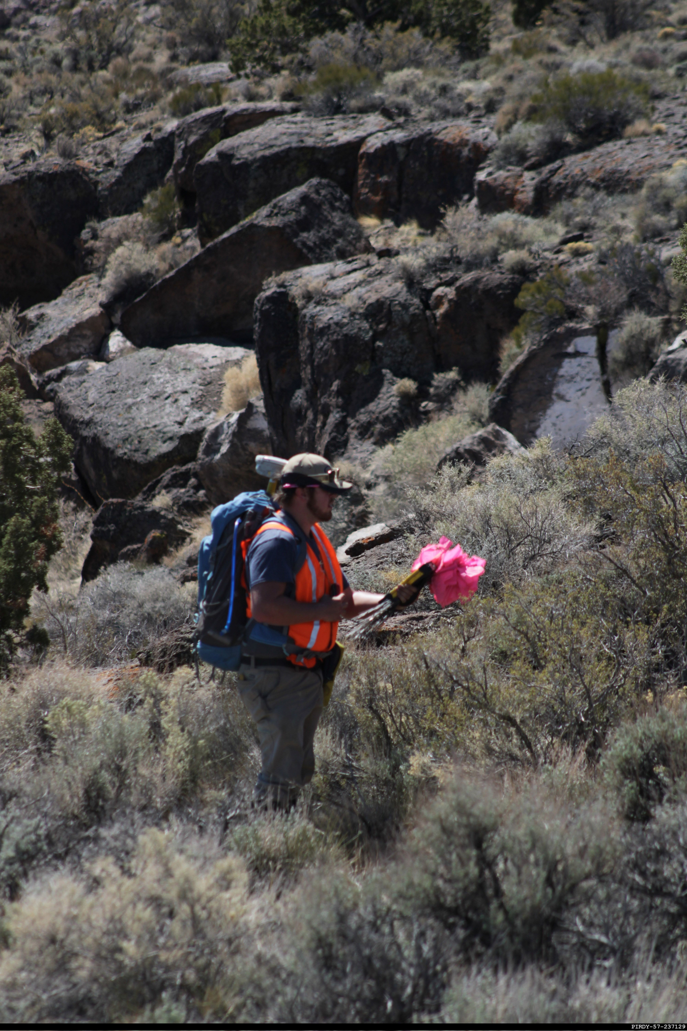 Using GPS, a worker places flags at fixed locations for the EM Nevada Program’s most recent geophysical survey on the Pahute Mesa on the Nevada National Security Site.