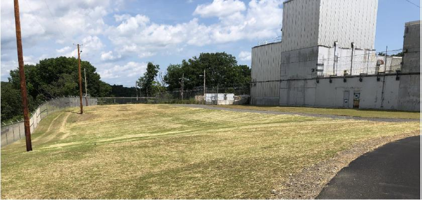 Former Building H2 footprint, backfilled and restored area