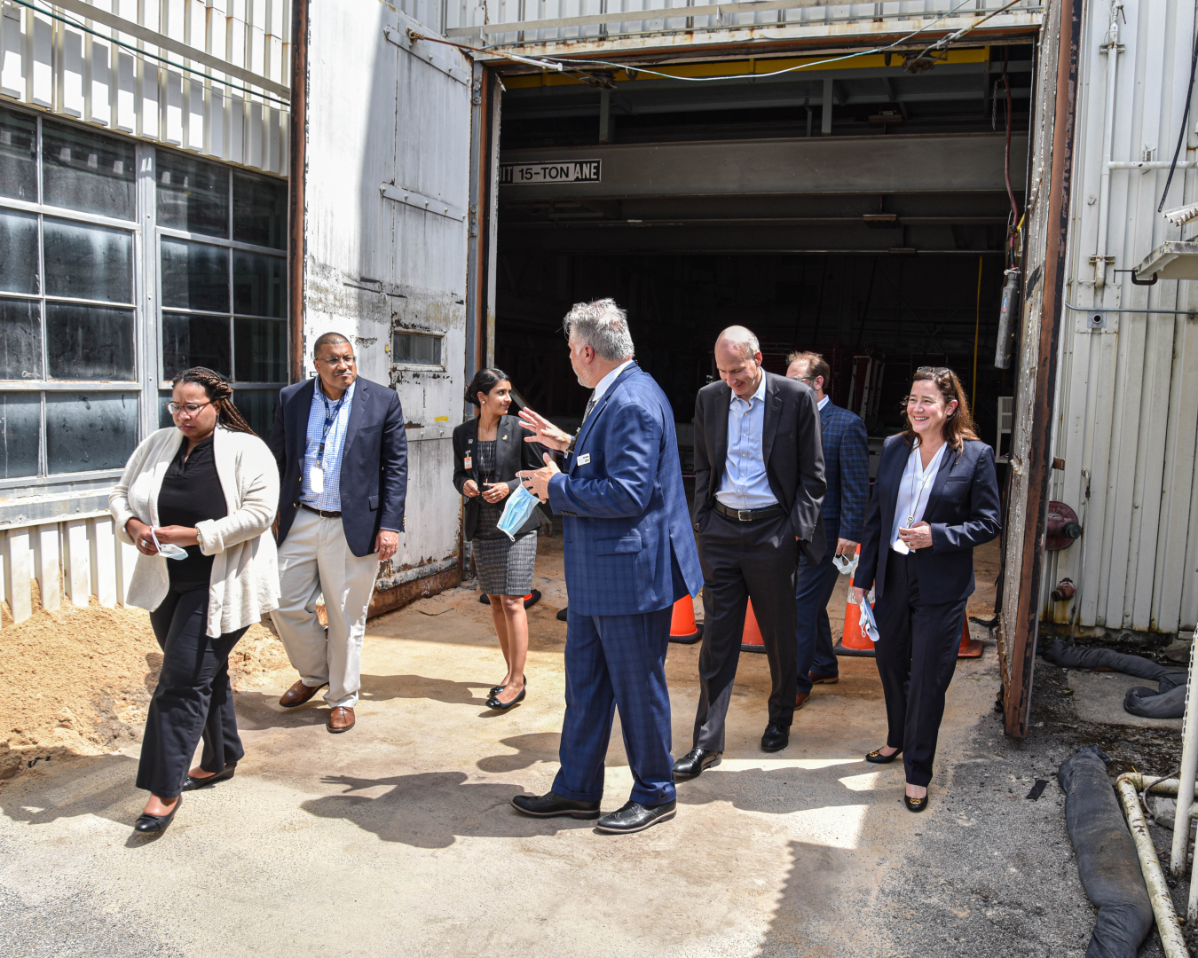 Oak Ridge Office of EM Acting Manager Laura Wilkerson, far right, and UCOR President and CEO Ken Rueter, center, walk with Deputy Energy Secretary David Turk, third from right, and his staff through the Bulk Shielding Reactor at Oak Ridge National Laboratory. EM crews are set to begin demolition on the former research reactor next month.