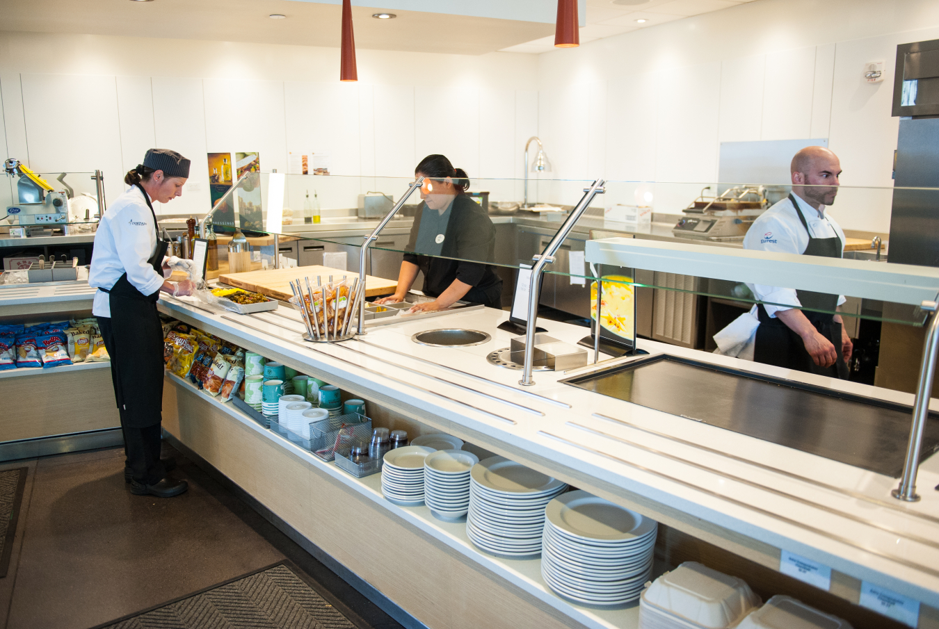 Three people in the National Renewable Energy Lab cafeteria.