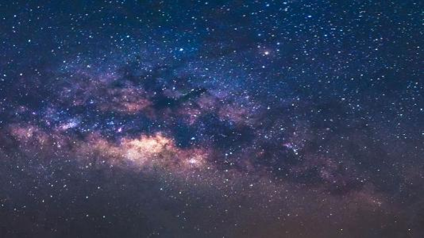 View of the Milky Way with blue, purple, and orange overtones.