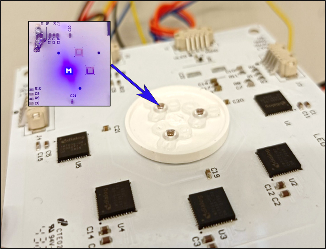 One module of the RGB beam steerable light engine is shown, with the insert showing individual pixel addressing of the blue phosphor-converted, 49 element LED die.