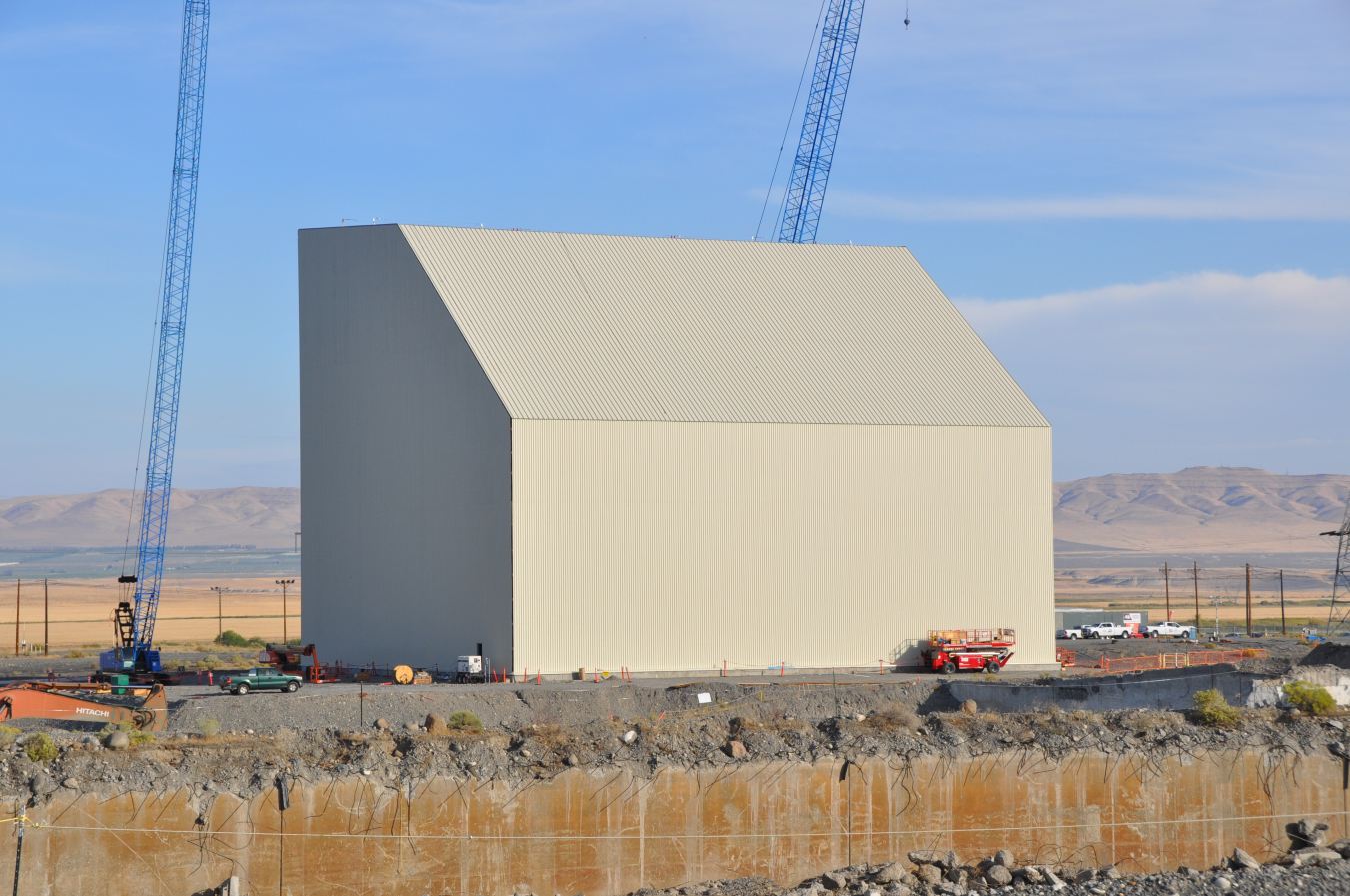 Workers with EM contractor Central Plateau Cleanup Company recently completed construction of a protective enclosure, or cocoon, over the former K East Reactor building. The cocoon is designed to protect the reactor building while the radioactivity in the deactivated reactor core decays over the next several decades, making it safer to complete disposition of the reactor in the future.