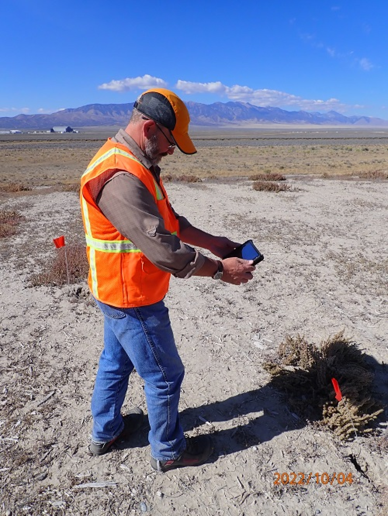 A technical specialist with the Environmental Restoration program for EM contractor Idaho Environmental Coalition (IEC), surveys a landfill site at the Test Area North at the Idaho National Laboratory Site