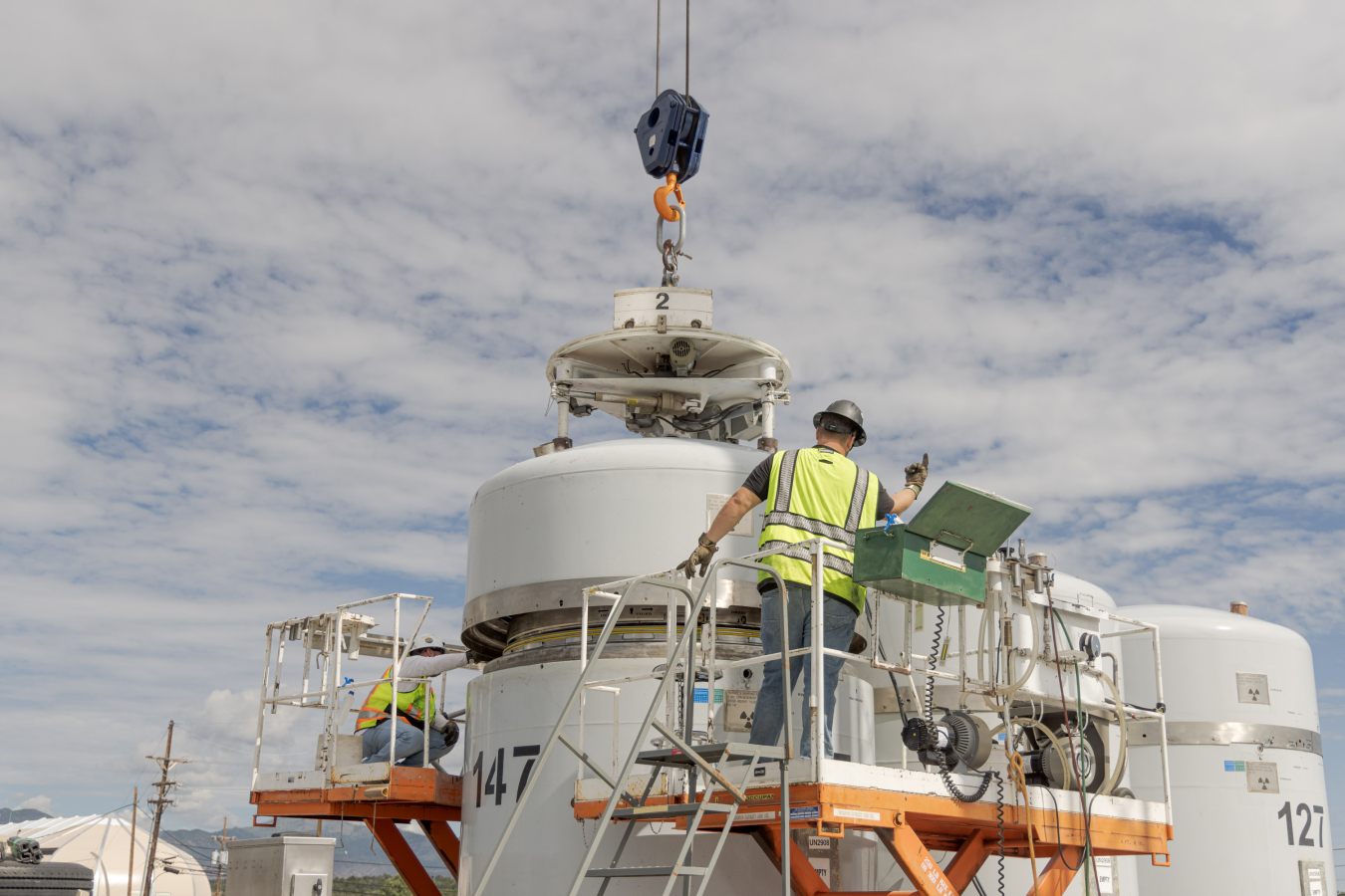 With the mobile-loading unit, Newport News Nuclear BWXT-Los Alamos operators secure the TRUPACT lid prior to shipping Los Alamos National Laboratory’s legacy transuranic waste to the Waste Isolation Pilot Plant.