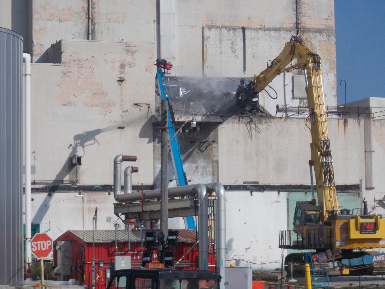 An excavator tears down the Solvent Storage Terrace as part of the deconstruction of the Main Plant Process Building at EM’s West Valley Demonstration Project.