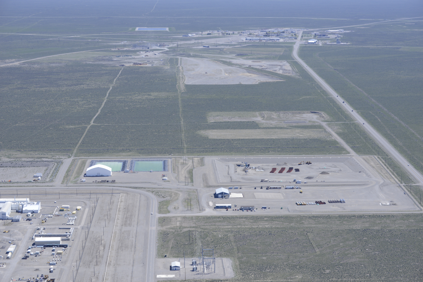 EM, the U.S. Environmental Protection Agency and state of Idaho have agreed to expand the Idaho CERCLA Disposal Facility at the Idaho National Laboratory Site by creating a new disposal cell adjacent to the existing cell at the center of the photo.