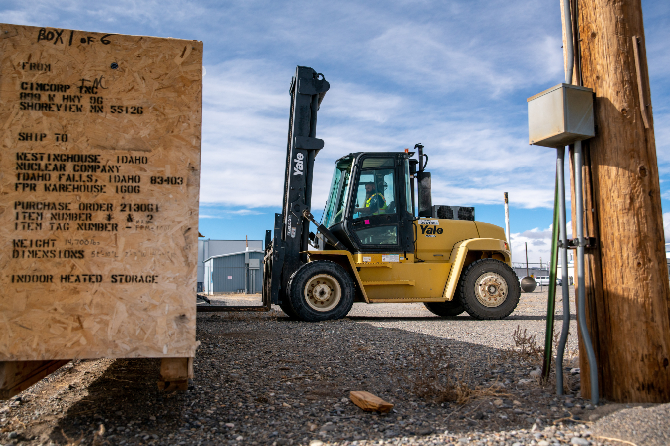 Gerald Clawson, a material specialist with EM contractor Idaho Environmental Coalition, prepares to load a crate of excess equipment outside the Fuel Reprocessing Restoration Facility at the Idaho National Laboratory Site. The shipment went to a scrap dealer in Blackfoot, Idaho, for compaction and shredding.