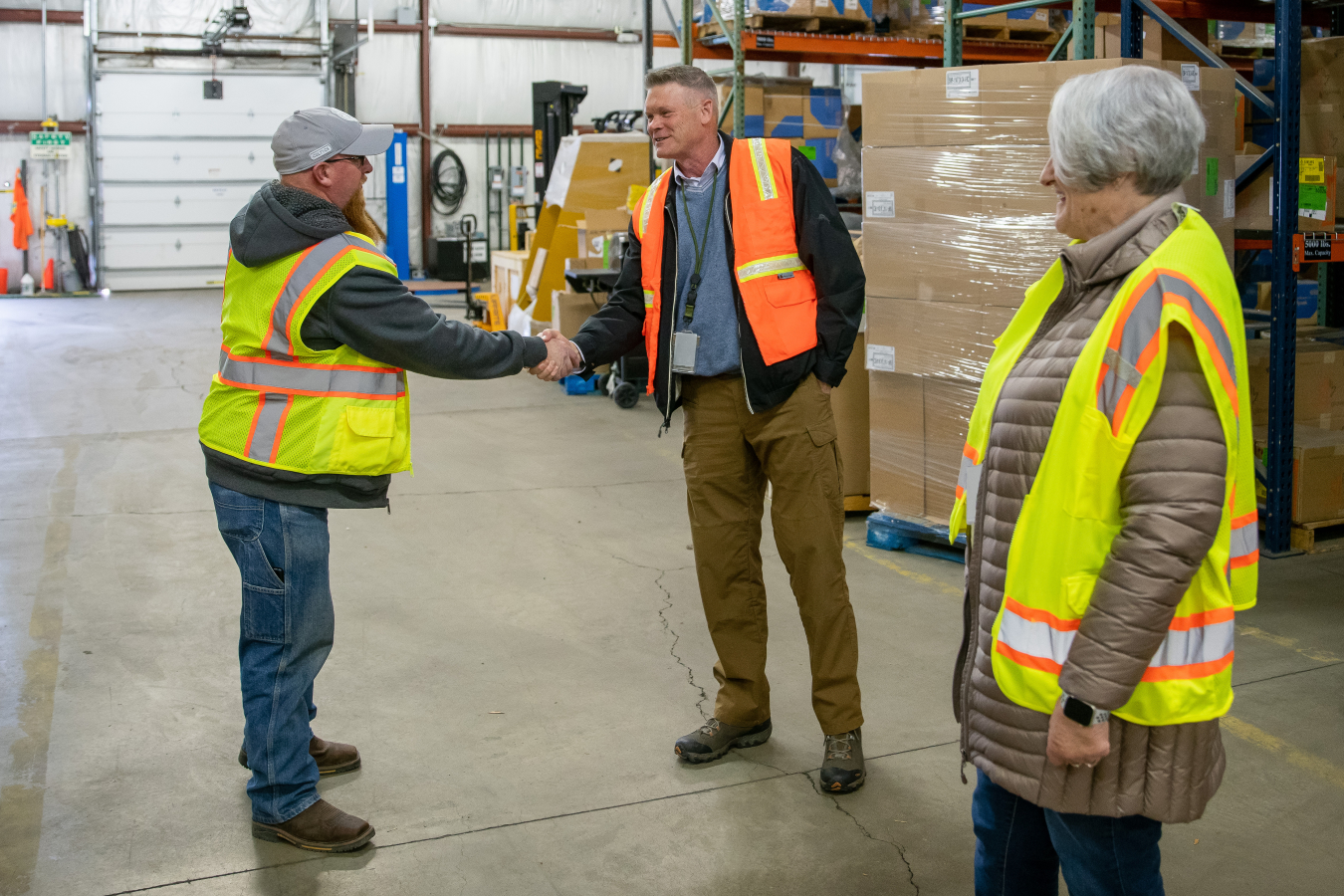 From left, Idaho Environmental Coalition employees Scott Hunting, Jack MacRae and Shawna Southwick meet at the Fuel Reprocessing Restoration Facility before the last of excess equipment left the Idaho National Laboratory Site.