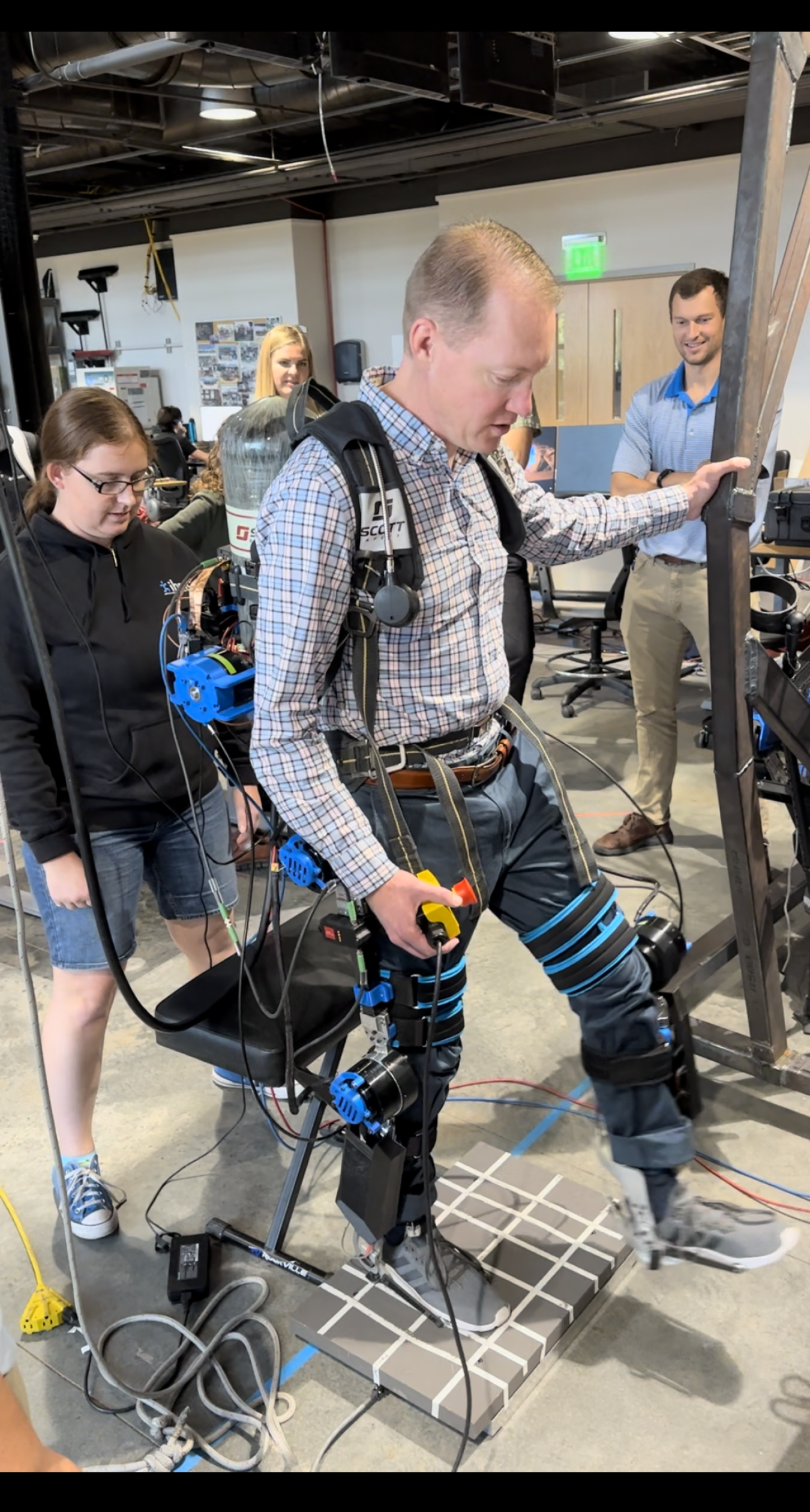 Jason Wheeler, a research and development staff member at Sandia National Laboratories, tries on a prototype exoskeleton for tank farm workers developed by the Florida Institute for Human and Machine Cognition. Wheeler is part of the team exploring wearable robotics and exoskeletons for EM’s workforce.