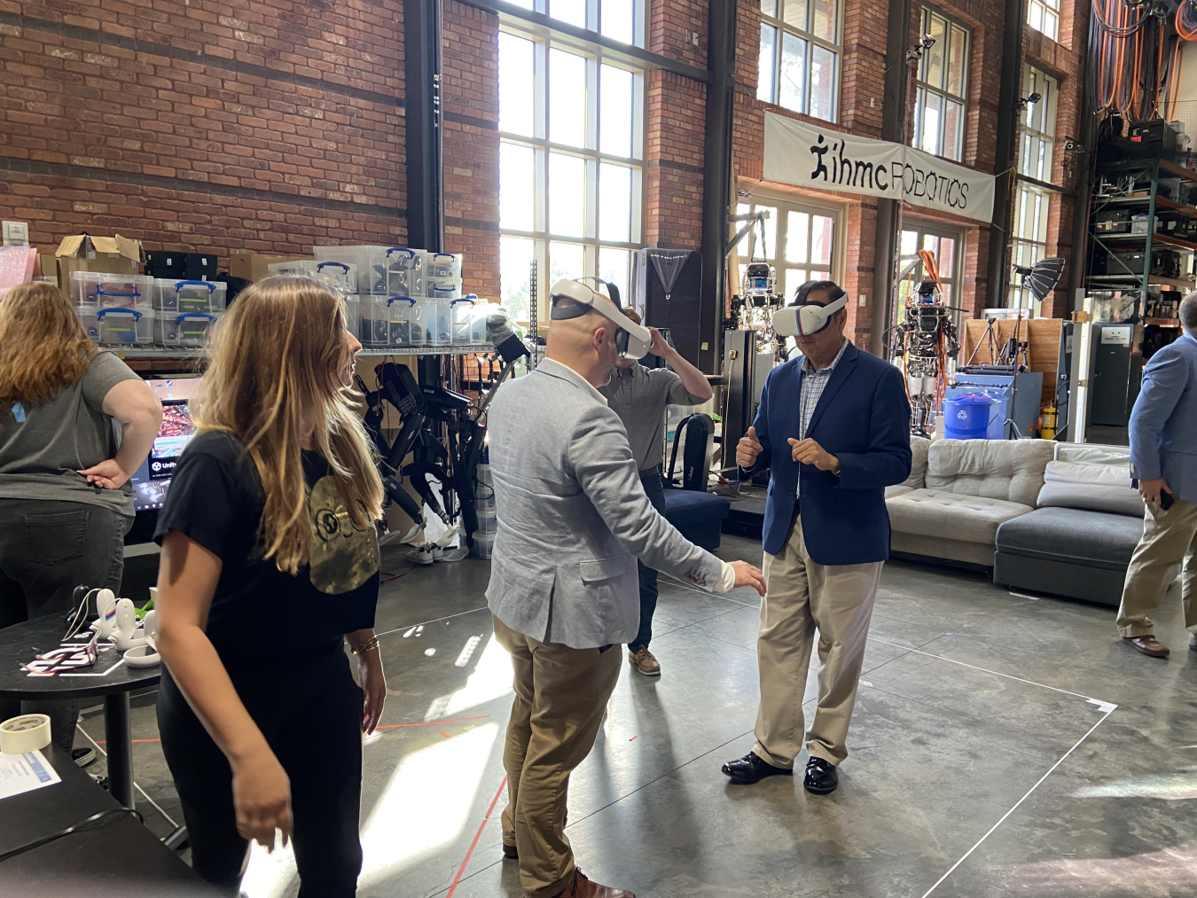 Jean P. Pabón, left, project manager with the EM Office of Technology Development Program, and Leo Lagos, director of research at the Applied Research Center at Florida International University, test virtual reality simulation of an EM worksite.