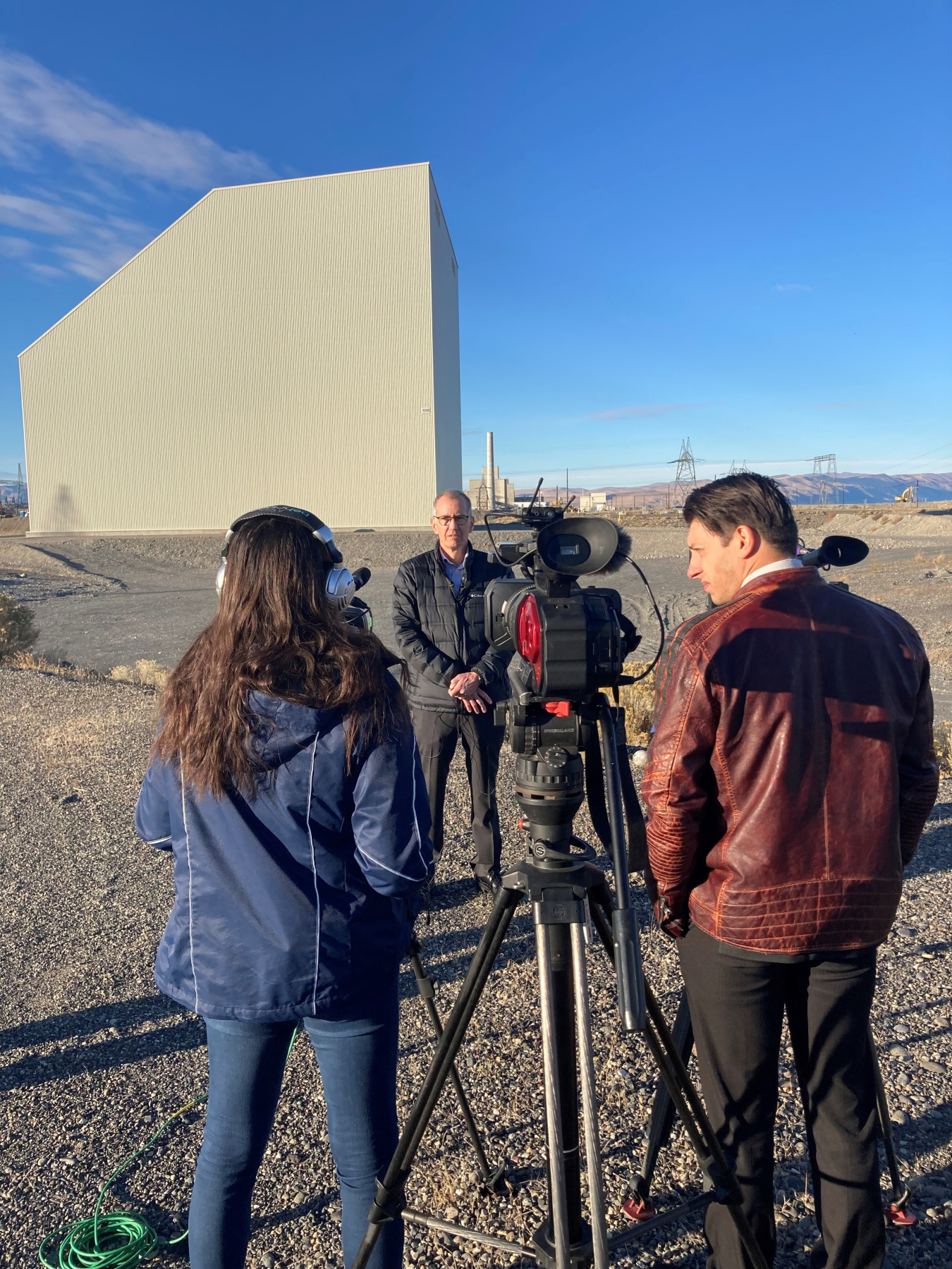 Brian Vance, manager of the EM Office of River Protection and Richland Operations Office, takes questions from local media in front of the newly cocooned K East Reactor building on the Hanford Site. 