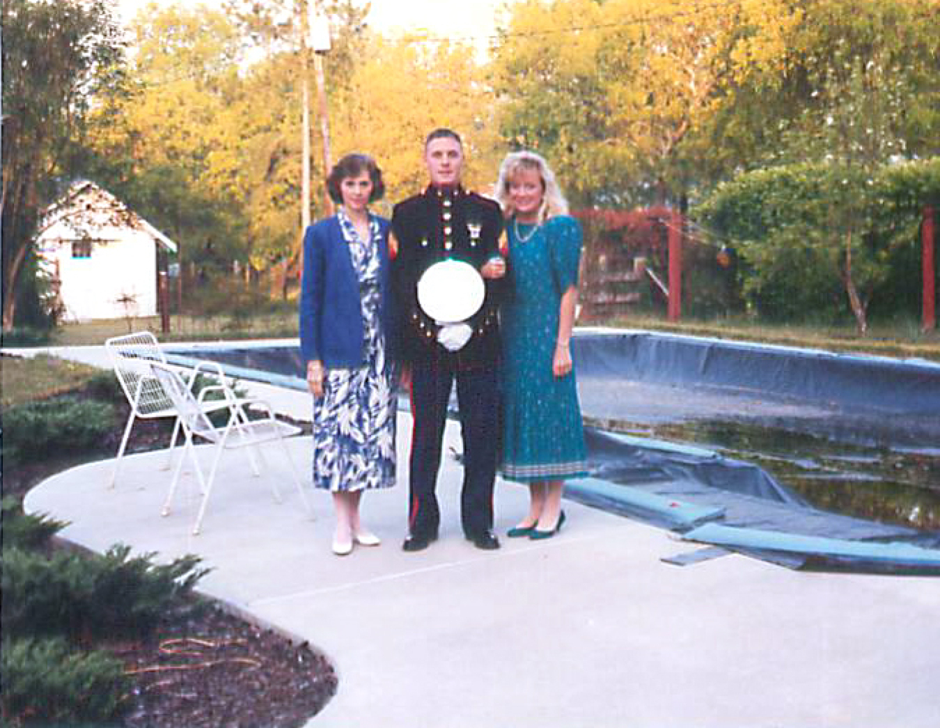 Photo of Charles Koss home on leave from U.S. Marine Corps with wife and mom. 