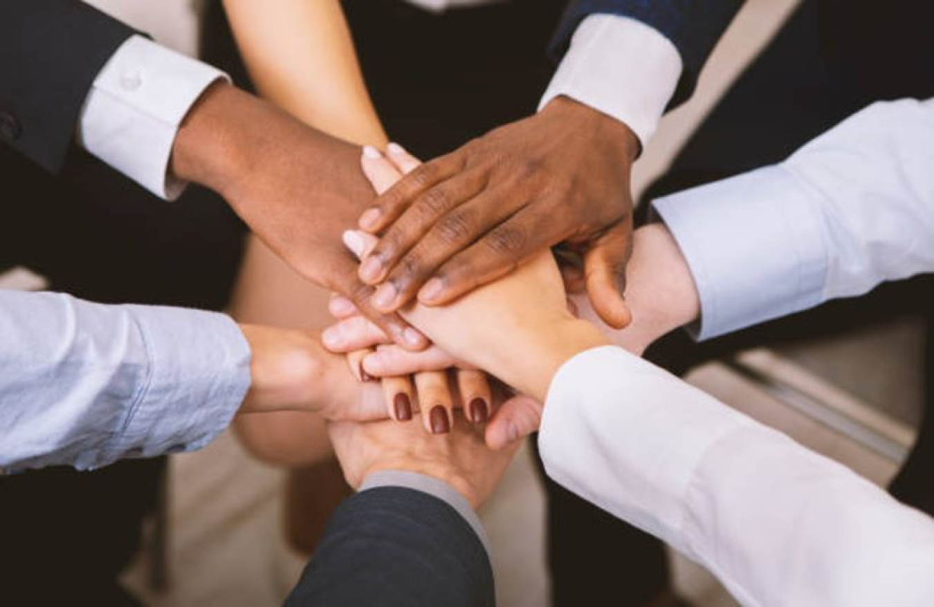 Diverse hands coming together