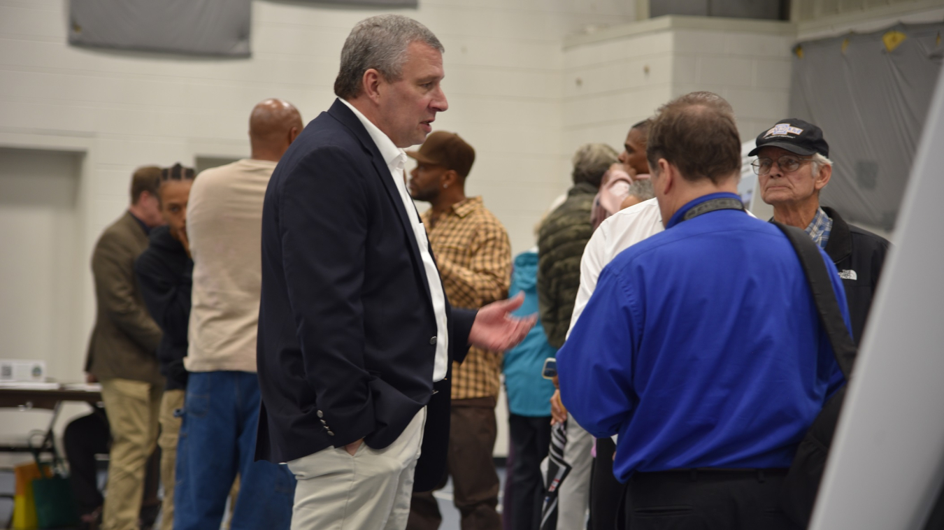 Oak Ridge Office of Environmental Management Regulatory Specialist Roger Petrie, left, answers questions and shares details about the Environmental Management Disposal Facility project to attendees of a public information session on Dec. 8.