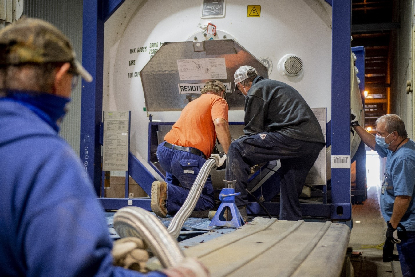 Four Rivers Nuclear Partnership’s deactivation crew pumps R-114 refrigerant into a specialized shipping container. In calendar year 2022, the team shipped 1 million pounds of the refrigerant offsite for treatment.