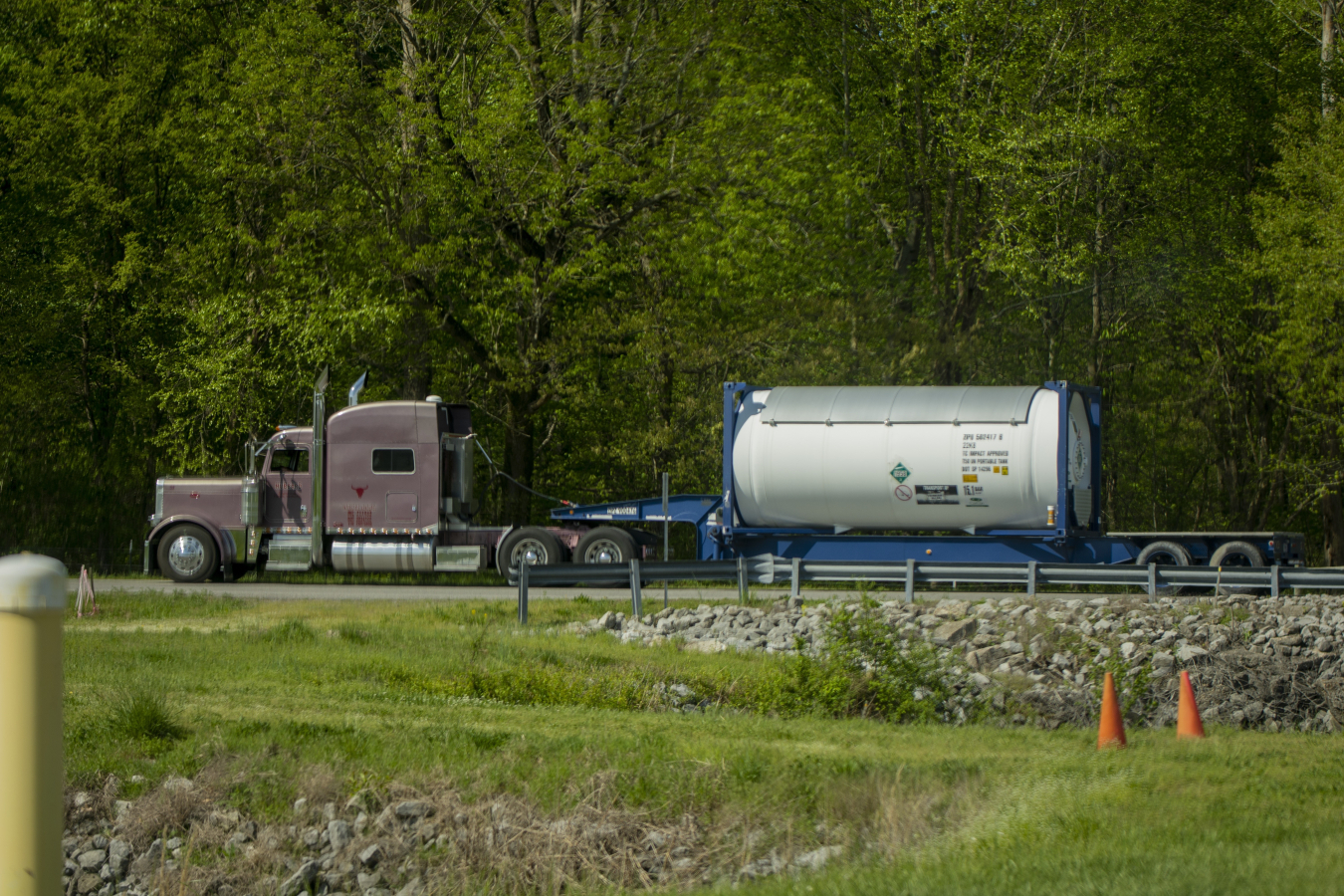 During calendar year 2022, EM’s Paducah Site packaged 1 million pounds of ozone-depleting R-114 refrigerant for offsite shipment and treatment using specialized containers like the one pictured here on a flatbed trailer.