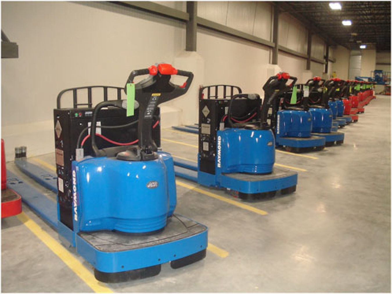 Fuel cell forklifts parked in a row.