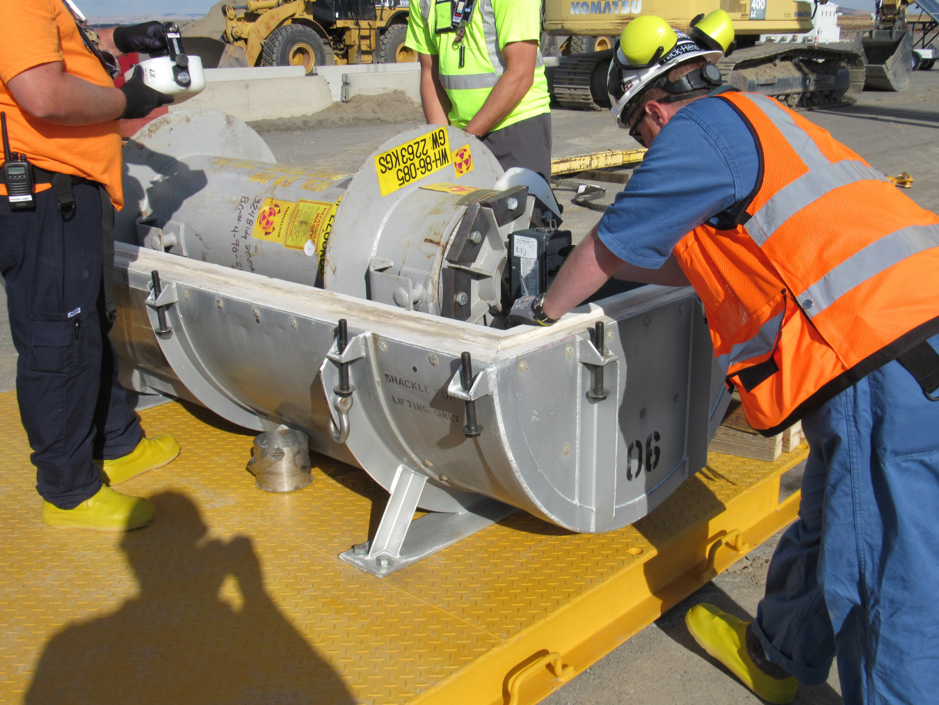 Workers packaged spent fuel containers before moving them to a nearby safe storage area on the Hanford Site.