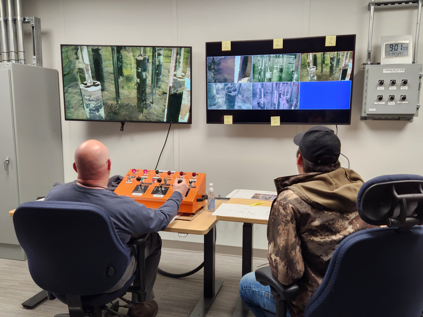 Members of the Single-Shell Tank Retrievals team use five cameras lowered inside Tank AX-101 on the Hanford Site to monitor activity as they remotely start a sluicer, which sprays water on the waste to break it down so it can be pumped out of the tank.