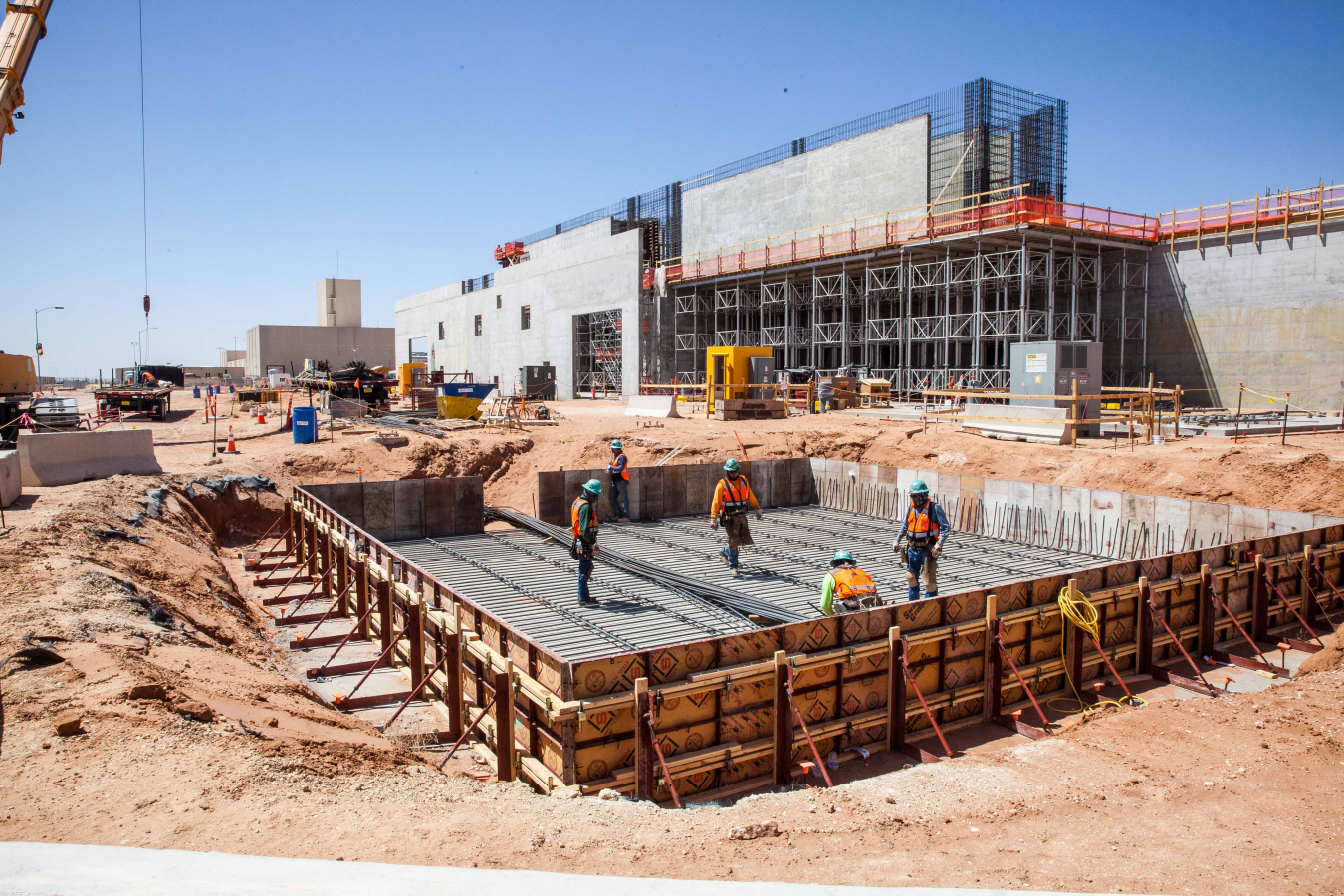 Workers prepare the base of a 125-foot exhaust stack for another concrete pour at the New Filter Building, part of the Safety Significant Confinement Ventilation System at EM’s Waste Isolation Pilot Plant.