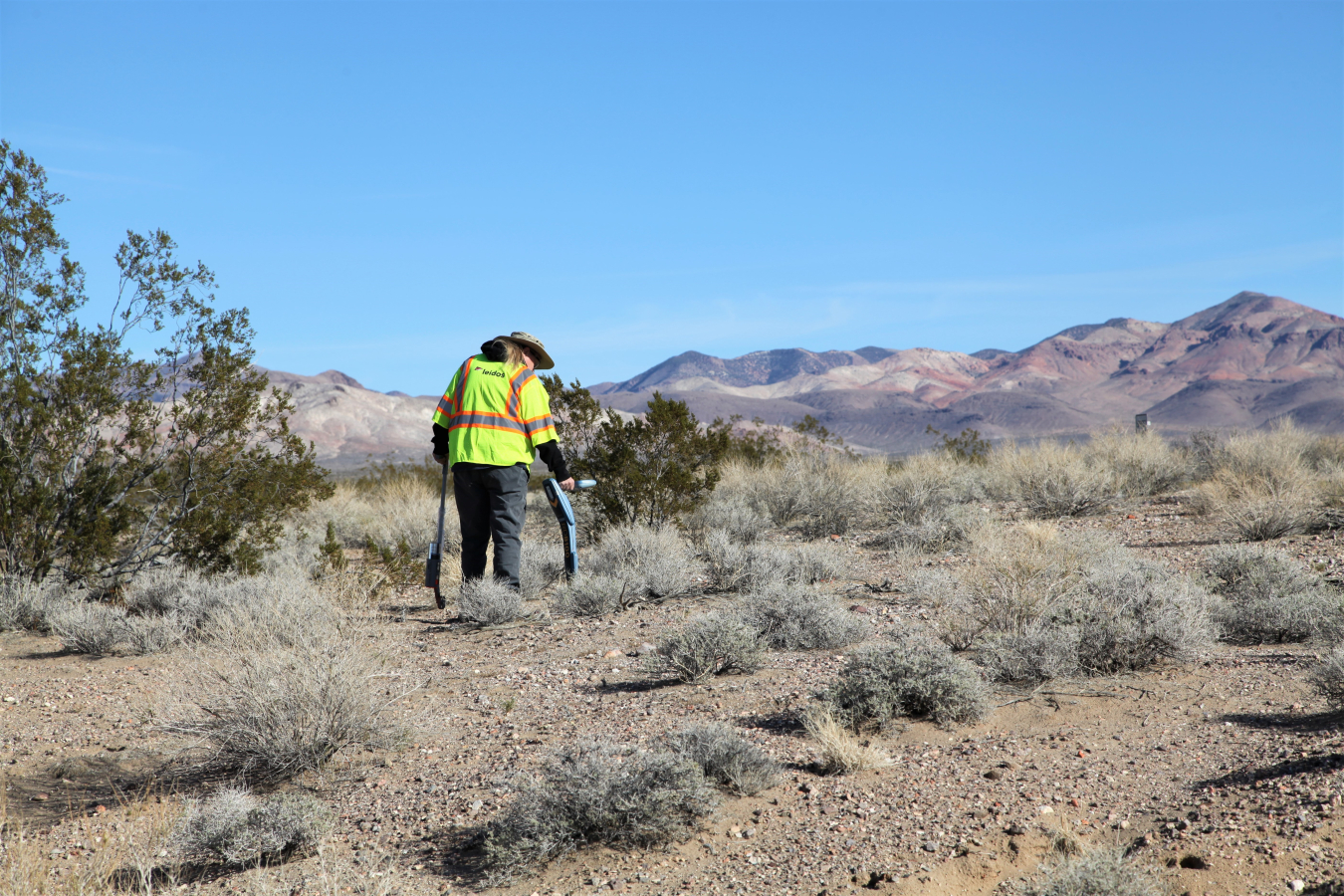 Geophysicist Beth Williams uses a passive locator device near the Engine Maintenance, Assembly, and Disassembly Facility at the Nevada National Security Site.