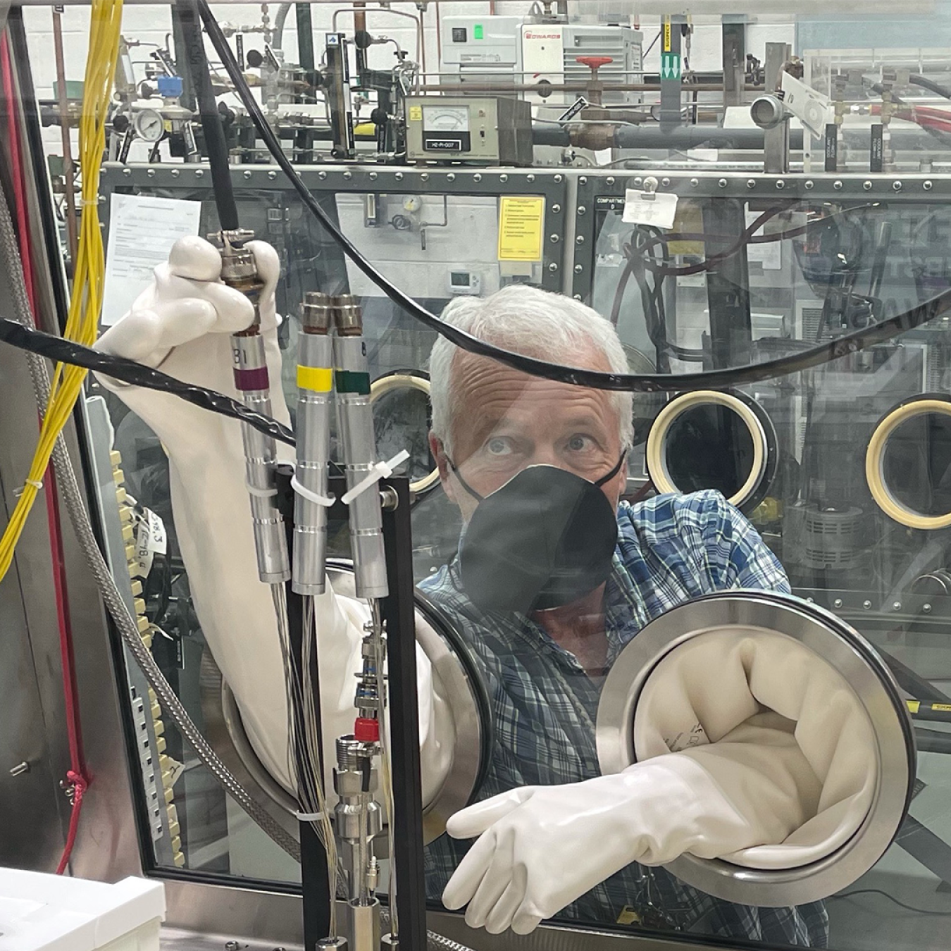 INL researcher preps experiment device