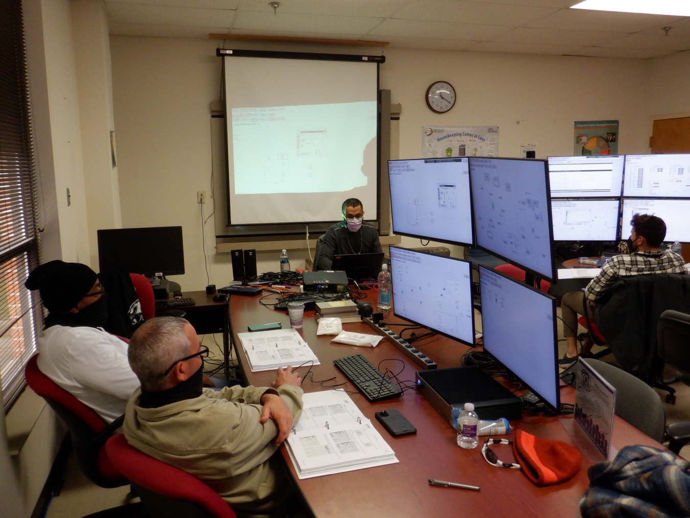 UCOR employees execute troubleshooting prior to the installation of the new Distributed Control System, including mock-up of all electrical lockout and tagouts to ensure safe compliance and system testing for infrastructure compatibility.